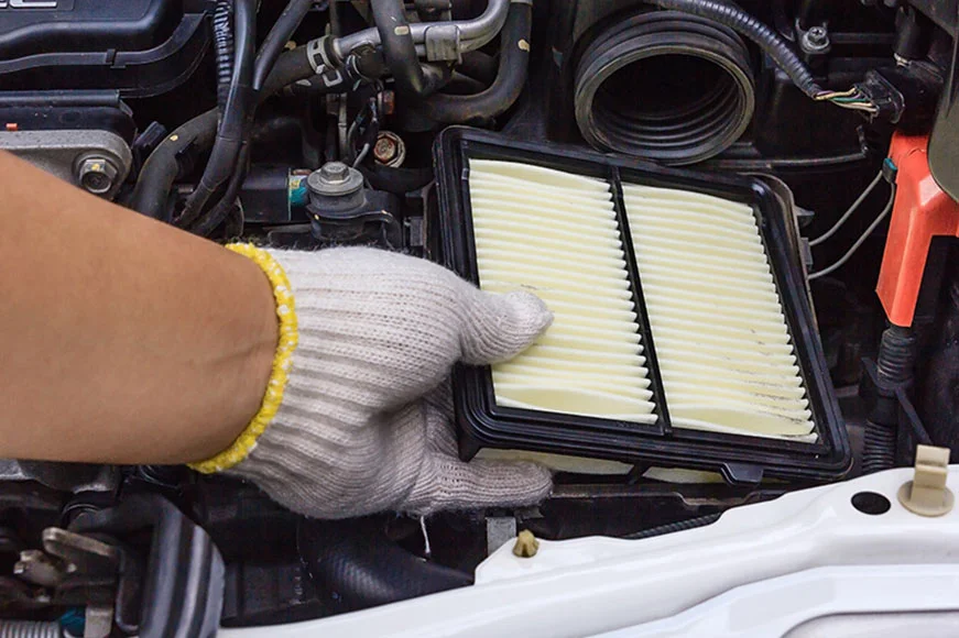 GMC SUV getting an air filter change