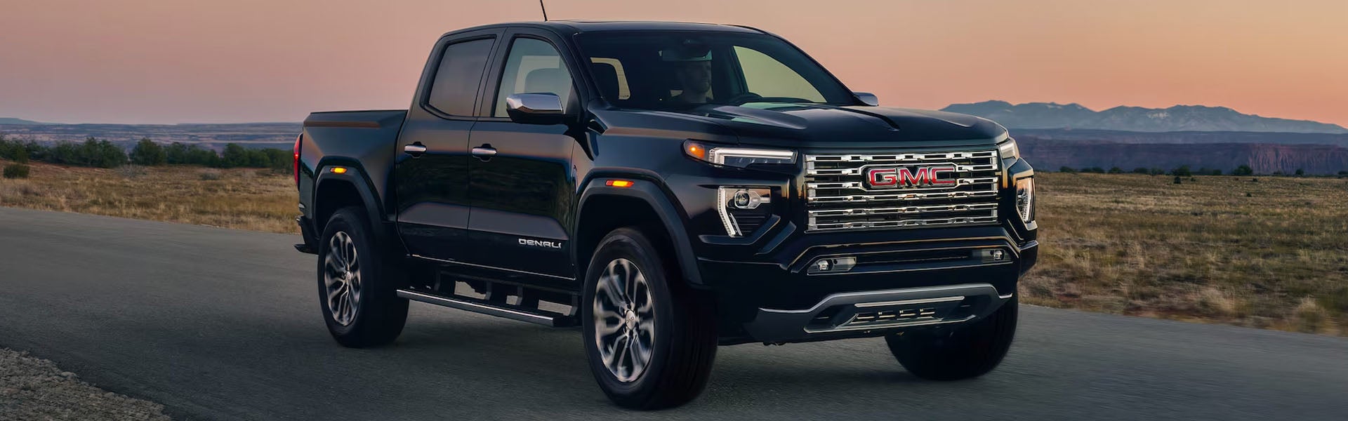 2026 GMC Canyon pickup truck showcasing rugged exterior design in an outdoor setting