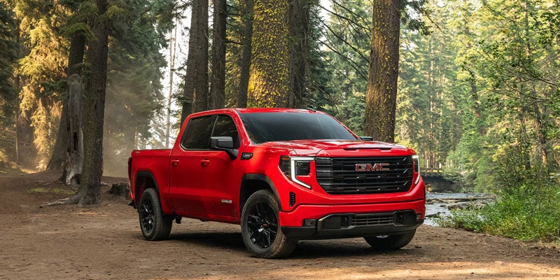 Red 2026 GMC Sierra 1500 with side angle view