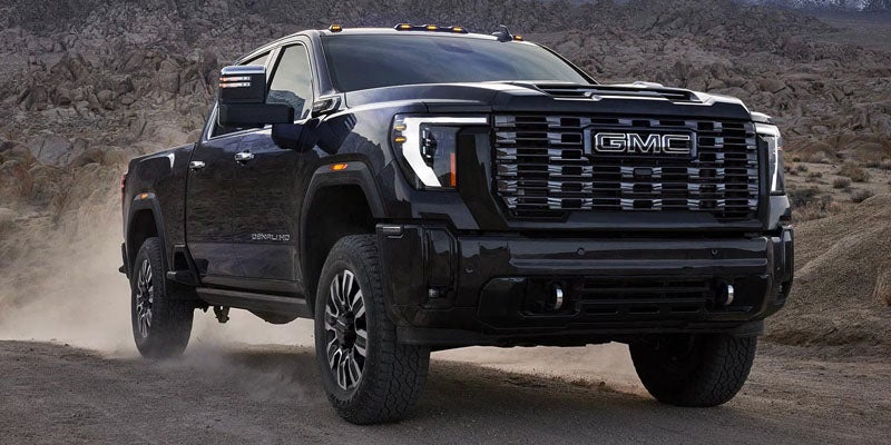 High-resolution close-up of the rugged tire used on a 2026 GMC Sierra 1500